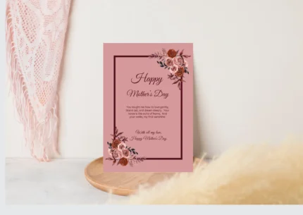 Close-up of an elegant Mother's Day greeting card featuring a border of blush pink and deep burgundy watercolor floral arrangements. The card has a loving message in cursive font and is a beautiful gift for mom.