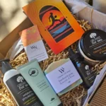 Close-up detail of Wheelers Hill handmade soap and Perfect Potion hand cream inside a Footy Fan Men's Grooming Gift Box.