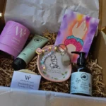 Luxury mum to be hamper with botanical skincare and ceramic trinket dish.
