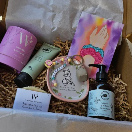 Luxury mum to be hamper with botanical skincare and ceramic trinket dish.