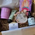 Luxury mum to be hamper with botanical skincare and ceramic trinket dish.