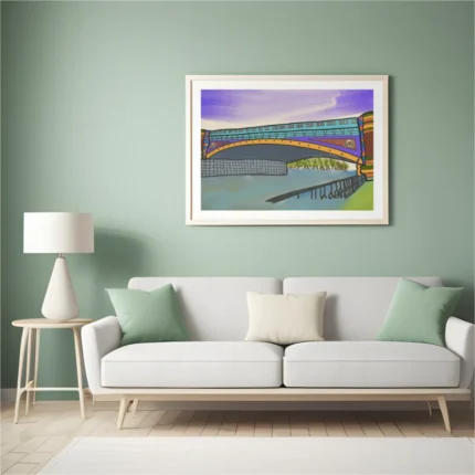 A large canvas print of the Yarra River Bridge Melbourne wall art styled elegantly above a modern grey sofa in a brightly lit living room.