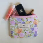 Pastel floral cotton fabric on a handmade zipper pouch